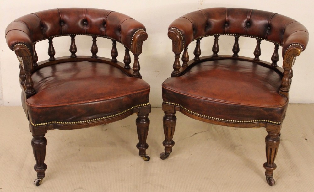 pair of victorian leather upholstered armchairs