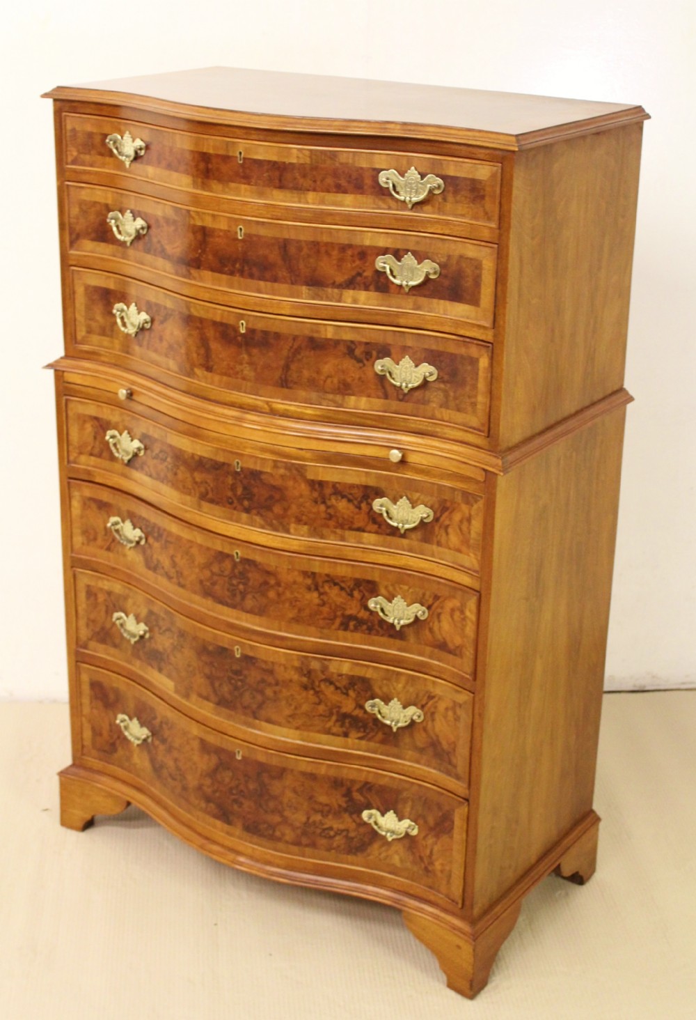 tall burr walnut serpentine chest of drawers