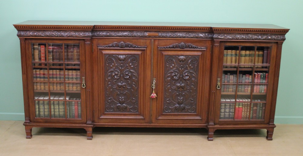 long victorian carved walnut bookcase by maple and co