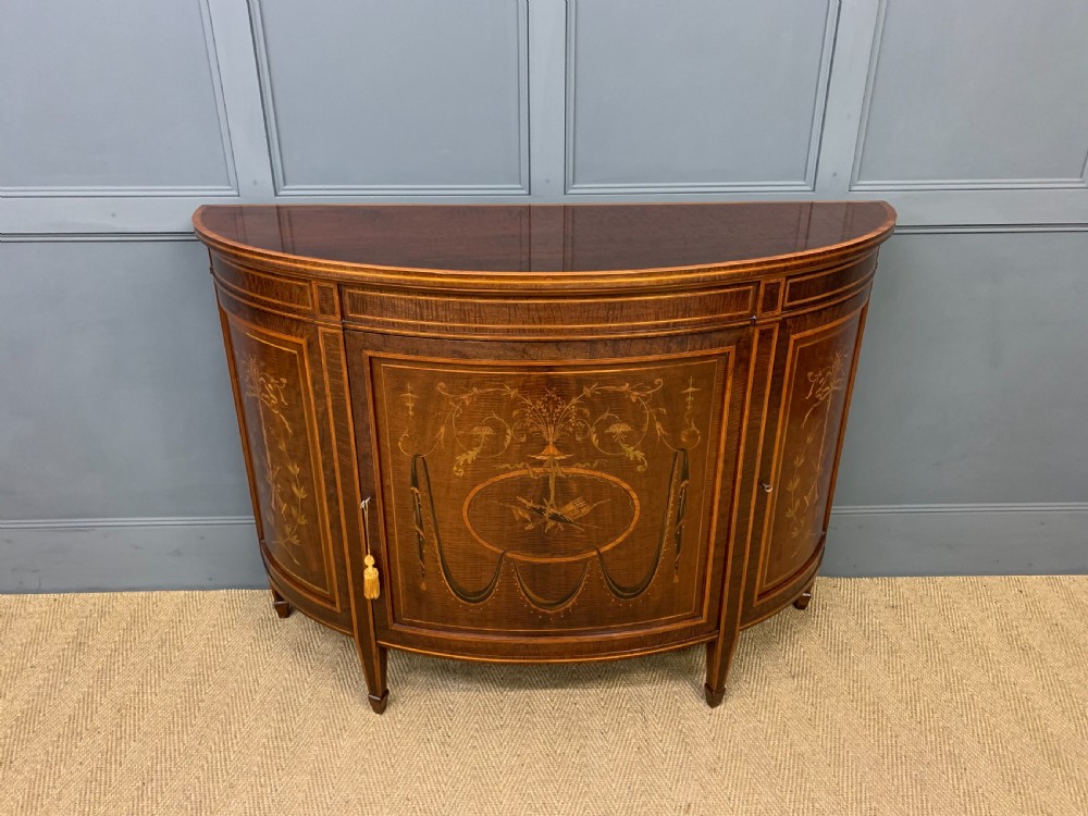 inlaid mahogany demi lune commode by druce and co