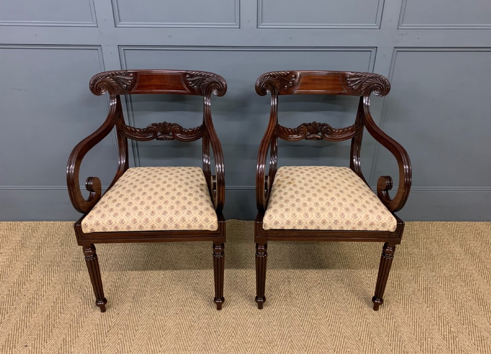 pair of regency mahogany scroll armchairs