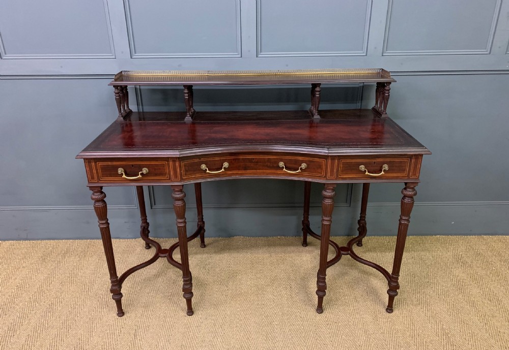 inlaid mahogany writing desk by collinson and lock