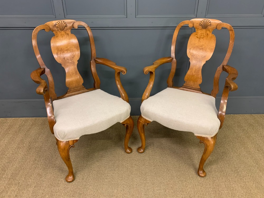 pair of walnut armchairs by maple co