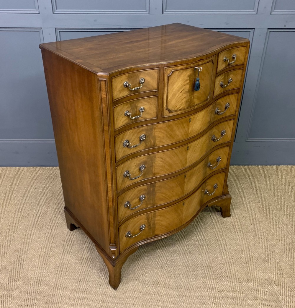 maple co serpentine fronted chest of drawers