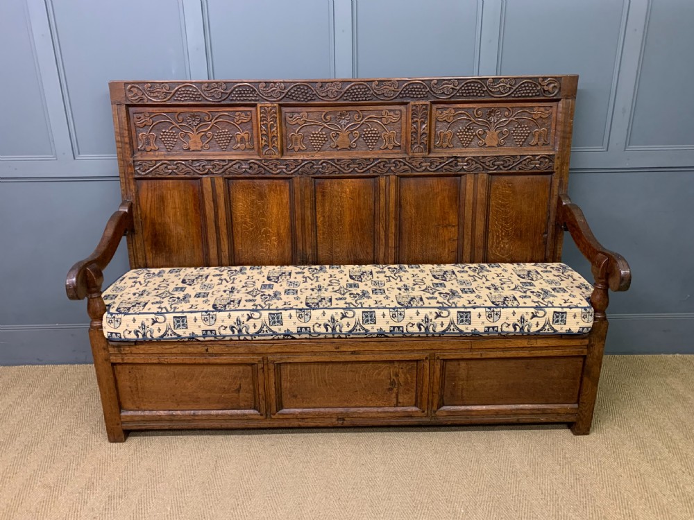 large 18th century carved oak settle