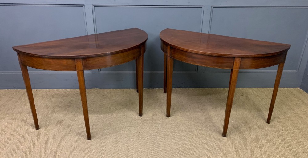 pair of georgian mahogany demi lune console tables