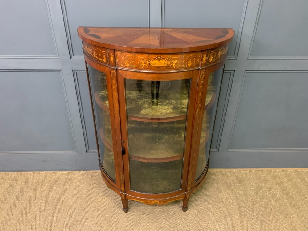 inlaid bow fronted display cabinet