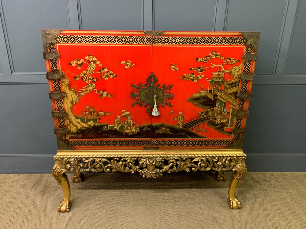 red lacquered chinoiserie cabinet on stand
