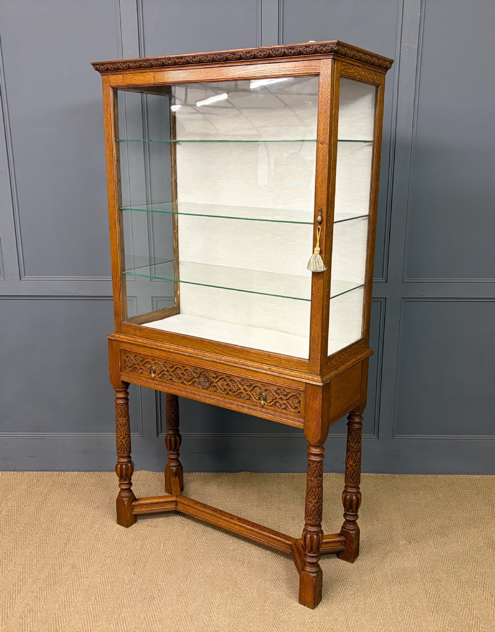 carved oak display cabinet