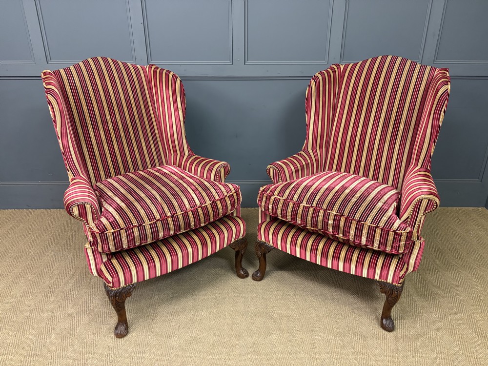 pair of upholstered wing armchairs